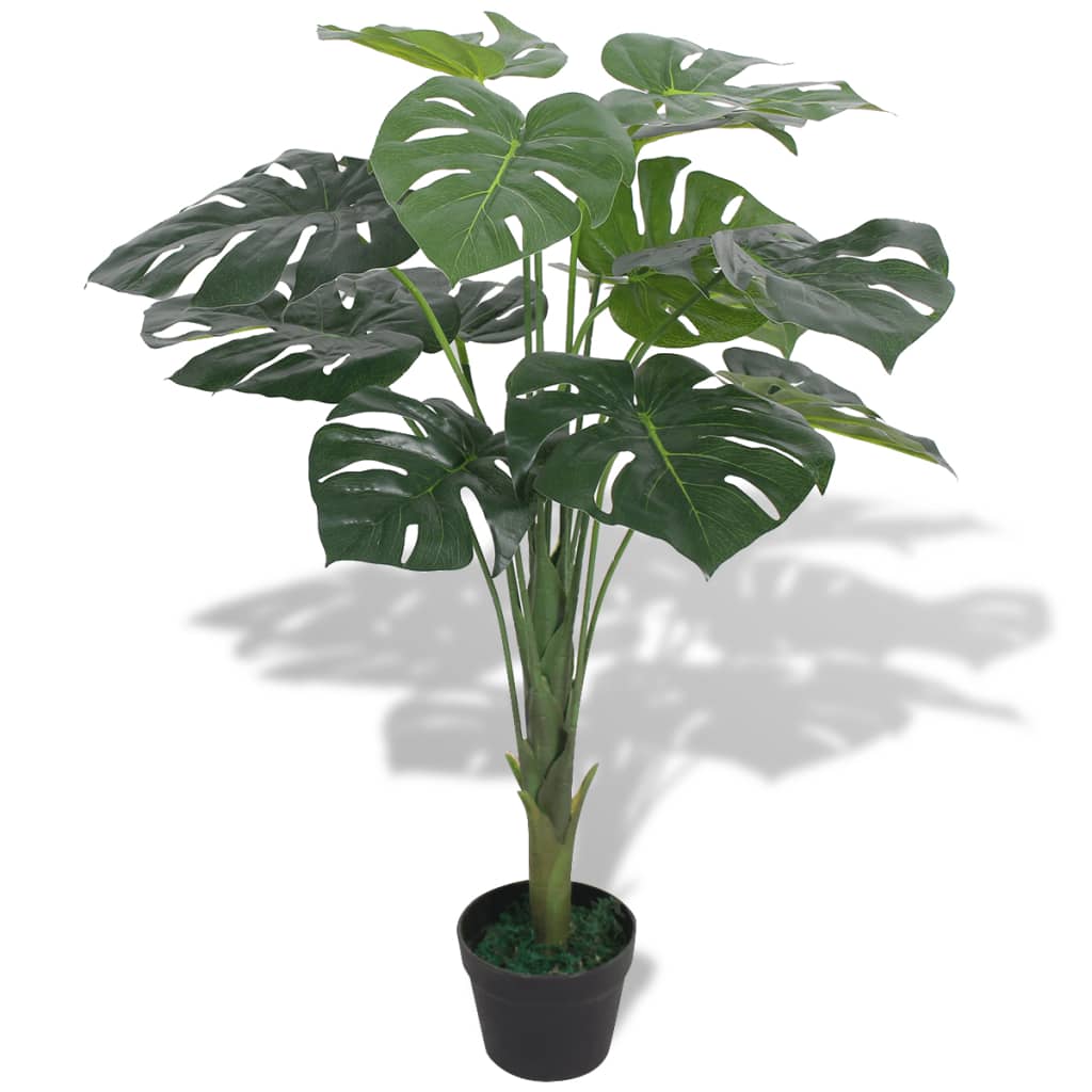 Realistic Artificial Monstera Plant with Pot 70 cm Green placed in a bright interior setting, showcasing 13 lifelike leaves.