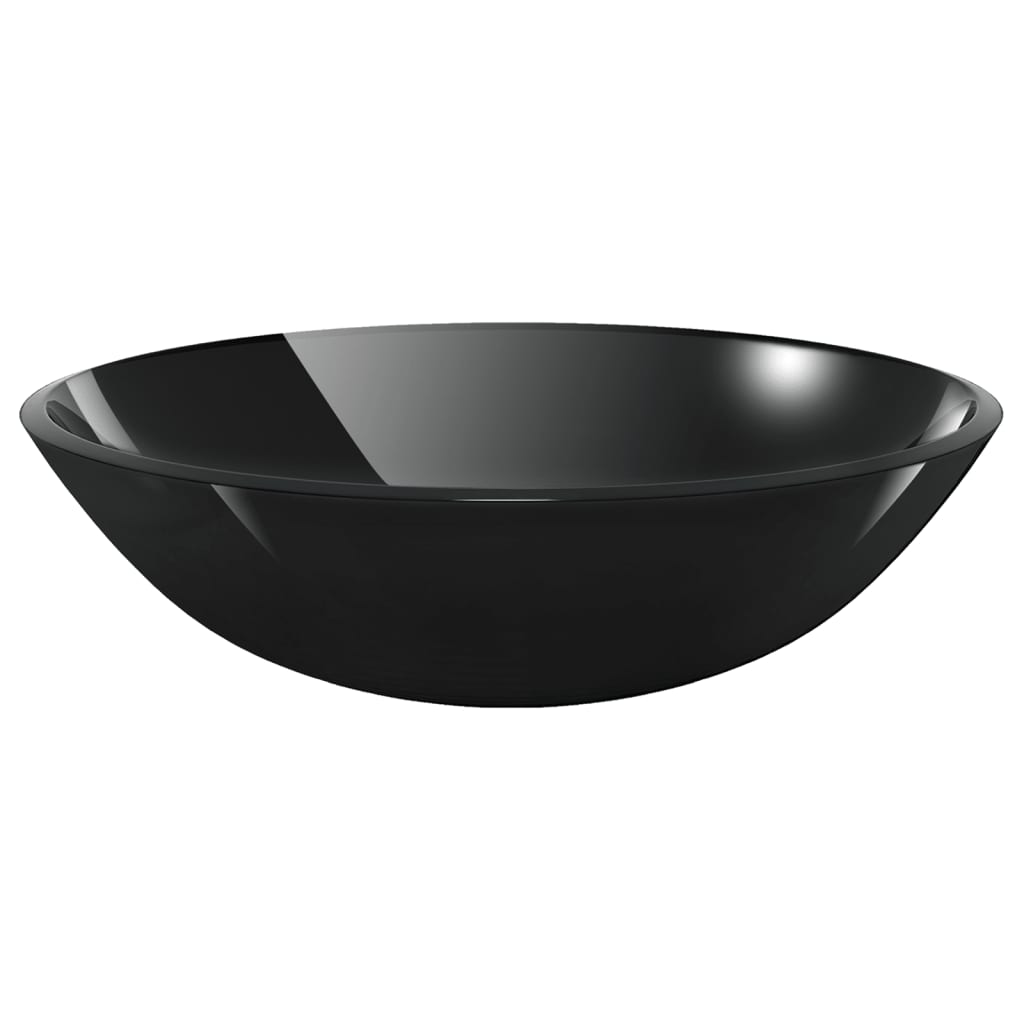 Bathroom sink with tap and push drain in black tempered glass, showcasing its sleek circular design for elegant countertop placement.