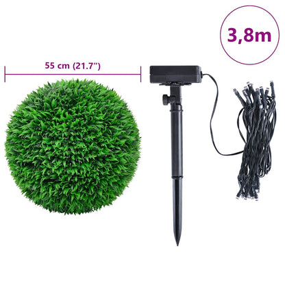 Artificial Boxwood Balls with LED Lights 2 pcs Green 55 cm creating a romantic atmosphere at night with solar-powered lights.